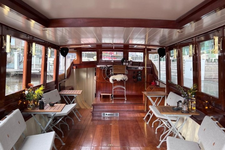 a living room filled with furniture and a large window
