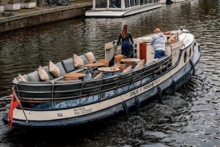 a group of people in a small boat in a body of water