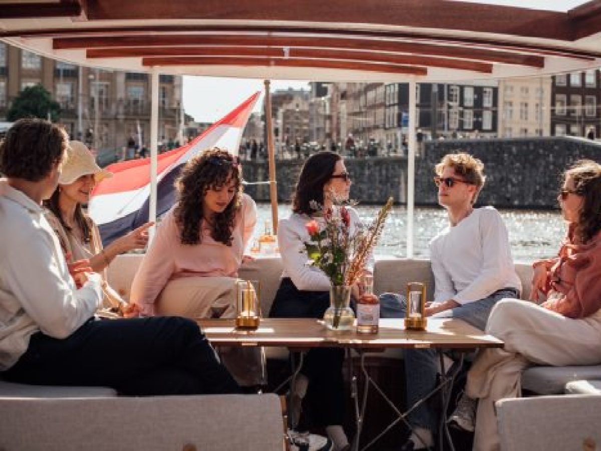 a group of people sitting at a table in a restaurant