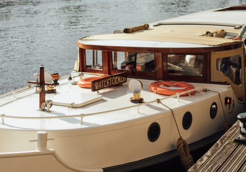 BOOTLOCAL-MARBLE-311-1-scaled-e1724074454994-1-qsubpzbng0efadt2yyde3kz9x6rl3gf99lzuly9tbg a boat sitting on top of a table