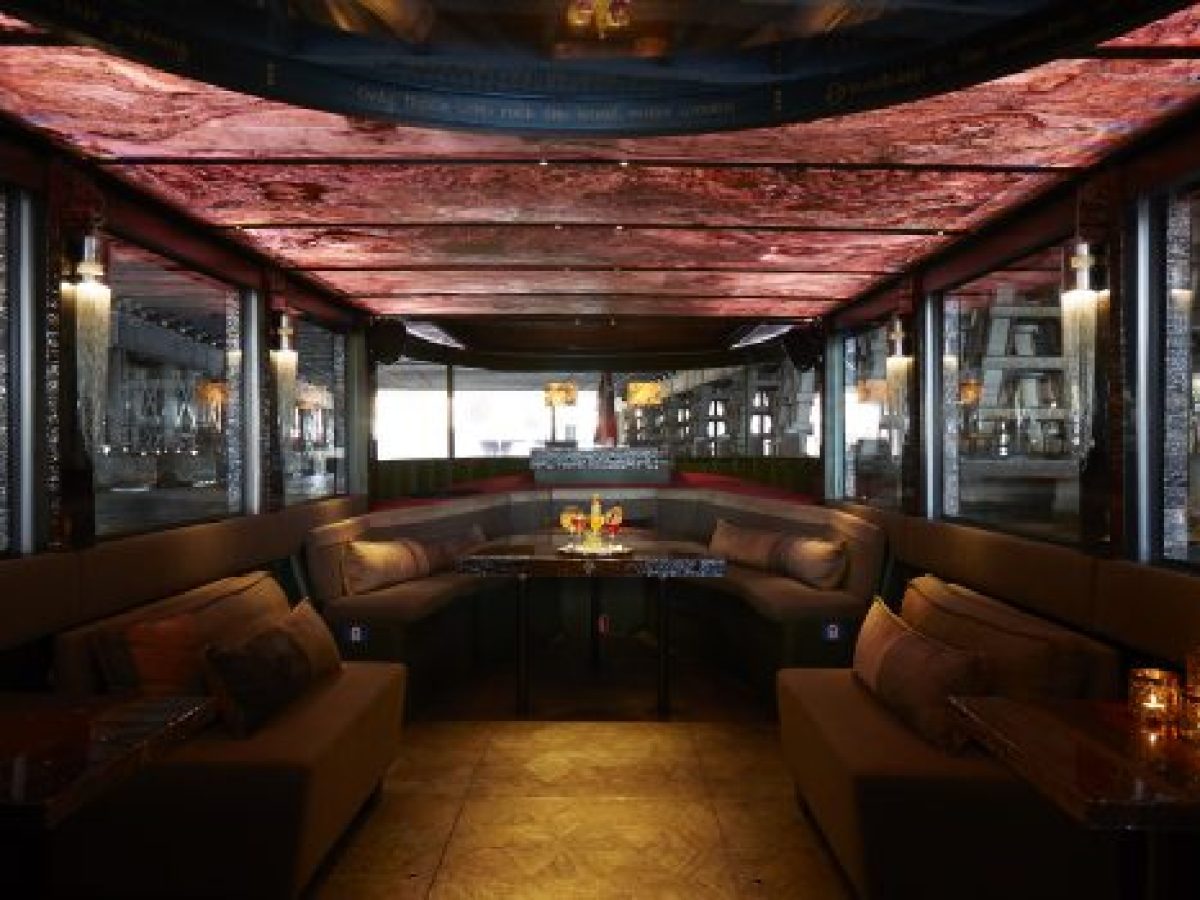 a living room filled with furniture and a large window