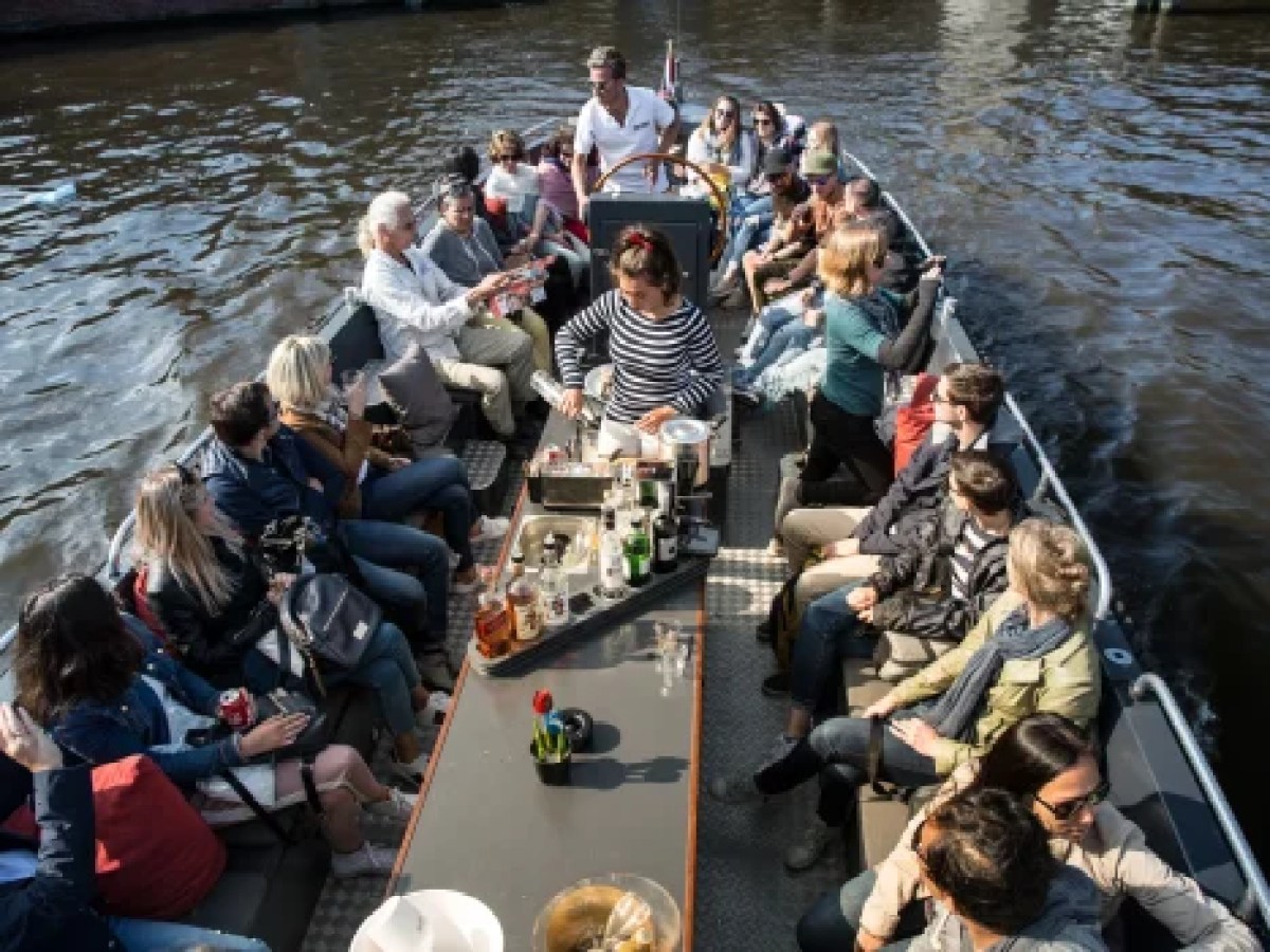 a group of people in a boat on a body of water