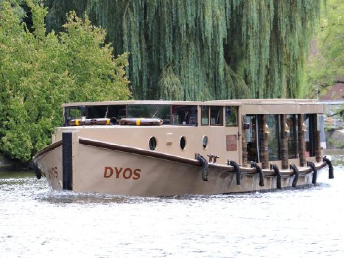 a group of people riding on the back of a boat