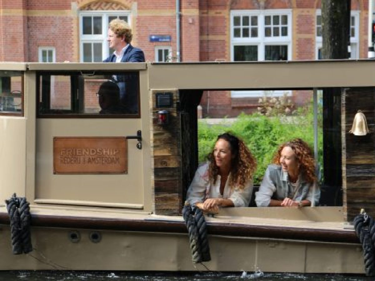 a group of people standing in front of a building