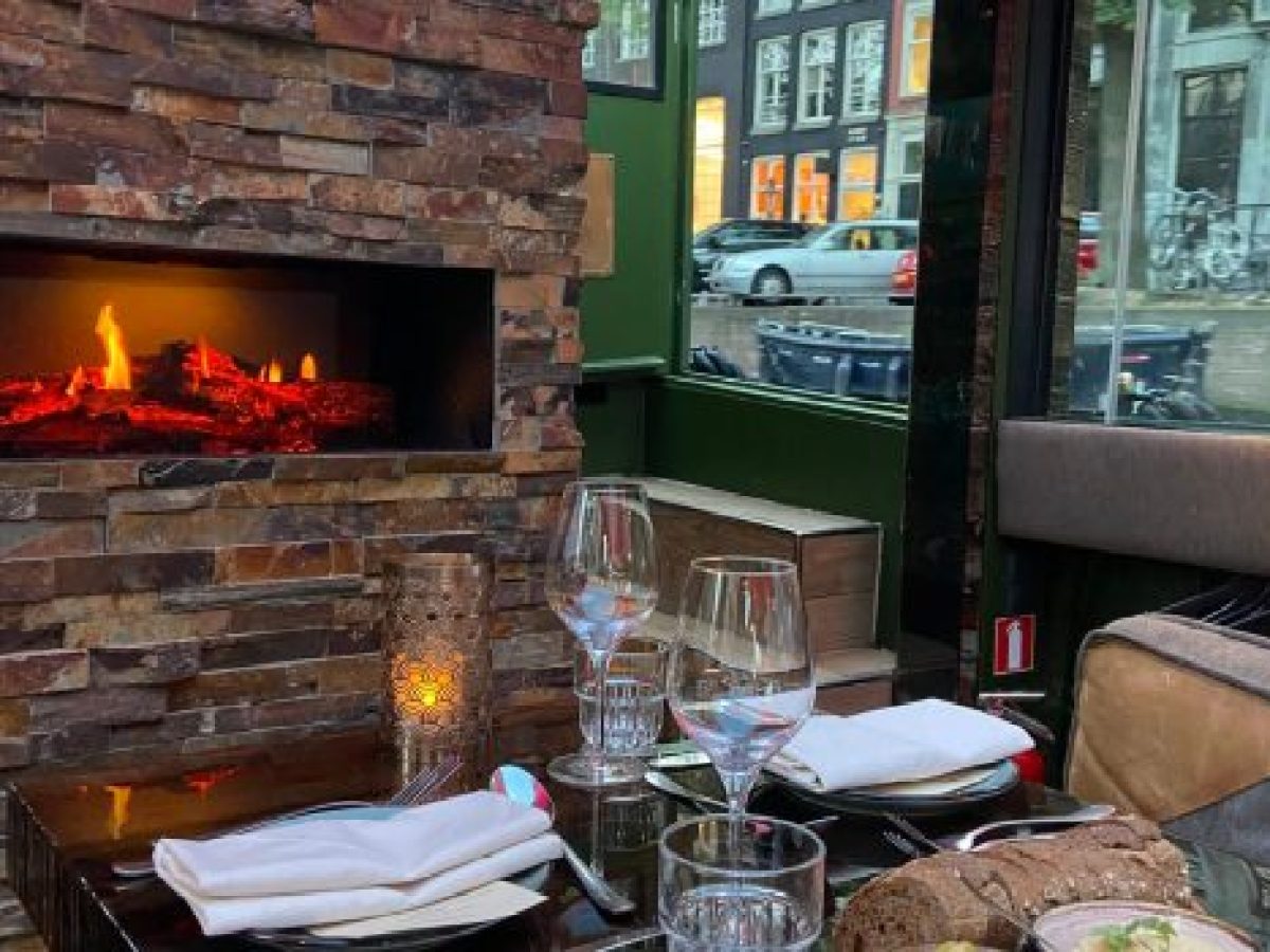 a fire place sitting in a living room with a fireplace