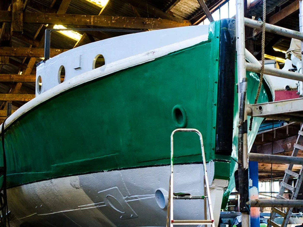 a boat parked on the side of a building