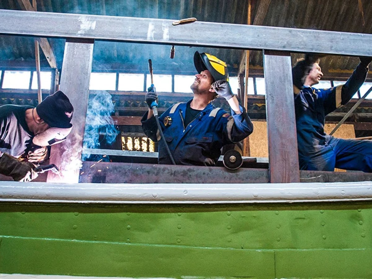a group of people sitting on a bench