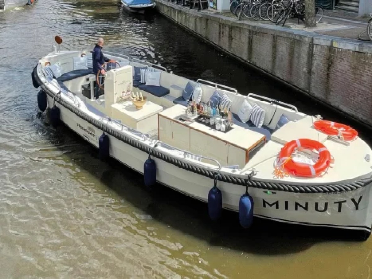 a boat is docked next to a body of water