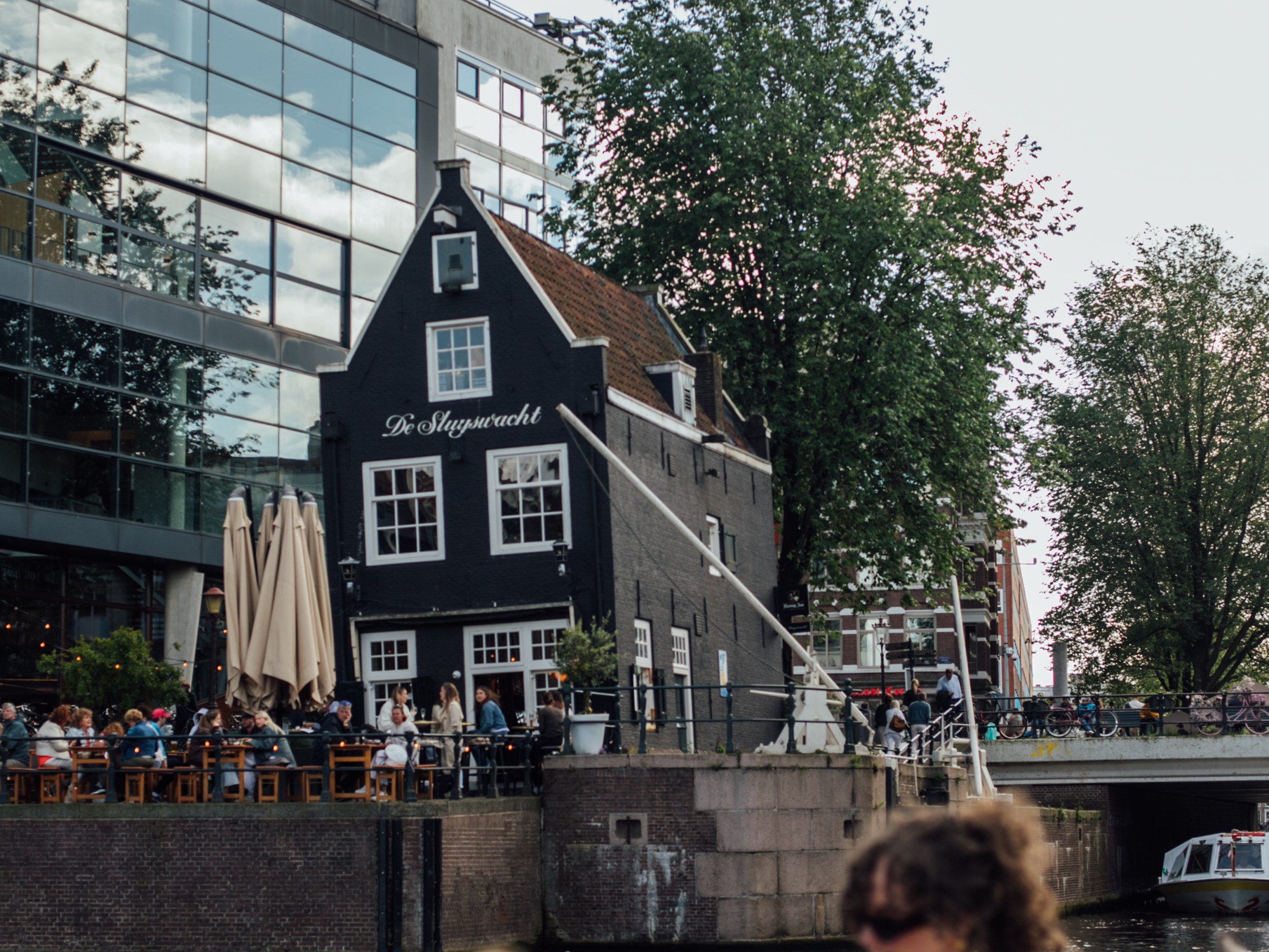a group of people sitting in front of a building