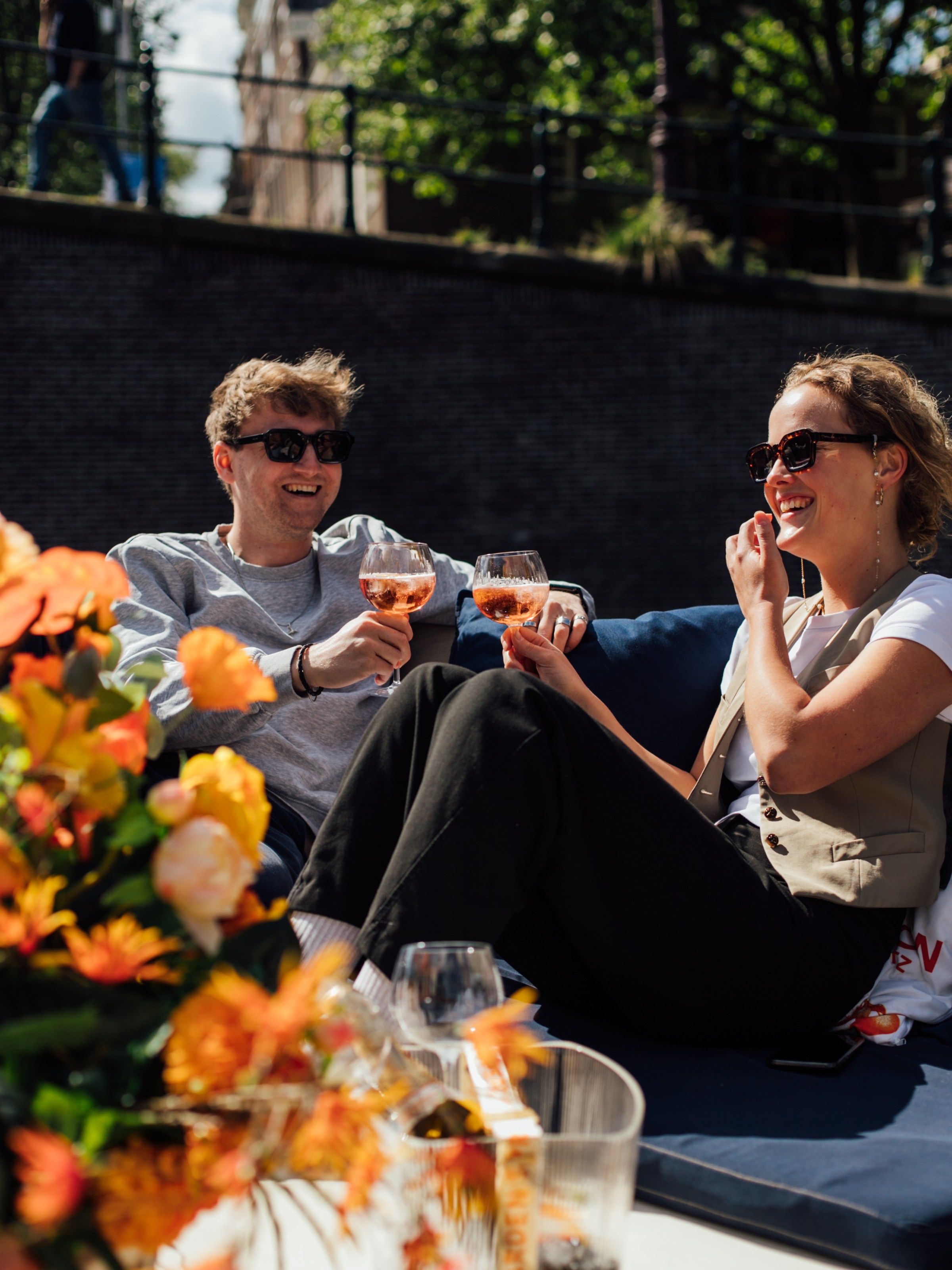 a group of people sitting at a table with food