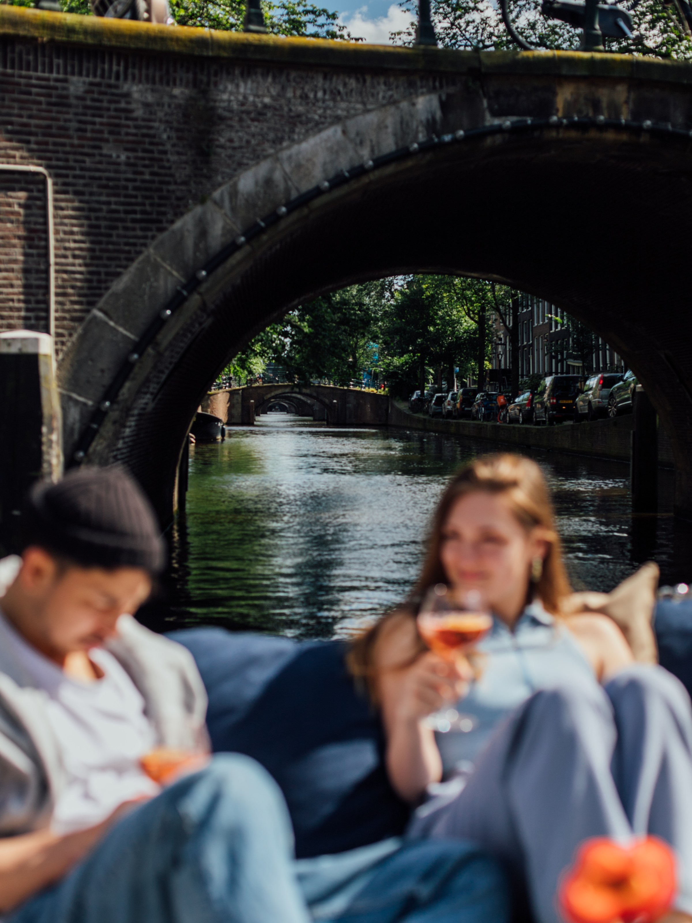 a group of people crossing a bridge over a river